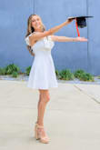 It was perfect for my graduation, and fit perfectly, it did make my bust look bigger bc of the ruffles. - Raquel S.