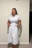 I'm surprised this dress fit me in a Medium. Based on the reviews, I decided to size down and so glad that I did. This fits perfectly! Love the style, the fit, and the pockets! - Brigitte S.