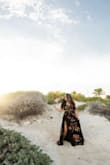 This dress was so easy to move in & it photographed like a dream. It is a full wrap around skirt, and is a little on the heavy side but it's a good thing so it doesn't just fly wide open. Easy adjustable straps and love the tieback top! - Natalie M.