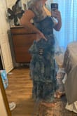 I bought this after trying on my friends in a large, and it was too big. I bought the medium and it's pretty tight. The zipper is not great quality and doesn't zip well. I love the print and ruffles. The dress is fun, and I love it other than the sizing and zipper. - Jamie O.