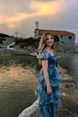 I loved wearing this dress so much! It is figure-flattering and has a gorgeous design that made me feel like a mermaid. Its colours add vivid and eye-catching and its fabric is light - ideal for a wedding by the sea in autumn. I have been really happy about this purchase - Paraskevi D.