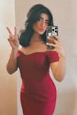Love this dress for a wedding I attended! There aren't any zippers but it's quite stretchy so slips on nicely! Pretty shade of burgundy red and lovely with the seasons changing from summer to fall soon.  Very figure-flattering. Easy to move around in and dance! Overall, happy with my purchase. - Nawaal F.