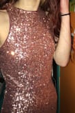Very pretty! I bought this for prom,and it's perfect. It's pretty long though and I'm a decent height. I don't think my shoes will be high enough to compensate for the length but other than that, I don't foresee any other alterations happening. I was torn between a small and an extra small, but a small fits perfectly with room to breath. It has a lining in it and it is not itchy. - Keanna B.