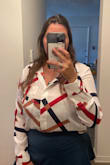 Great fit. I usually wear L but it depends on blouse/short style. I ordered M and it feats perfect on bust, length and arms. The textile is light, and the buttons do not open on my bust area!!! Definitely recommend. - Jackie B.