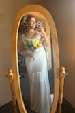 This was my wedding dress, and I got so so many compliments on how beautiful it was! The pictures do not do it justice. I should've sized down to a large but got it altered instead. The top can get taken in quite a bit without making the armpits too tight. Would recommend it to any bride! - Erica Z.