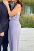I'm obsessed with this jumpsuit. Every time I wear it I feel so confident and stunning. It has a looser fit, with lots of stretch. I wore some Spanx shorts under to smooth everything, I feel like it's a bit thin to textures on bottom/thighs.

I'm 5'10 and length is always an issue. This was perfect, even with a full heel for me! The open back, amazing- I tried to include a pic to show, that's the best I found. - Ashley H.