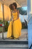 This dress is beautiful! The material, the color, and the look overall were memorable for my showcase. I had to return it and get an XS which was perfect. The slit was cut a little high so had to so it but I'm so happy with my purchase and will definitely buy again. Oh and no bra needed :) - Chadina M.