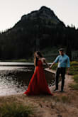 I purchased this dress for an outdoor engagement photo shoot and it was absolutely perfect. The bottom flows perfectly in a breeze or as you walk. I was worried that the red was going to be to bright or loud for me but it wasn't at all. The dress is on the longer side. I wore it bra-less but you could wear sticky boobs if you prefer. 100% worth the price! I've gotten SO many compliments on my engagement photos and messages from random people asking where I got this dress. I can't recommend it enough! - Emily R.
