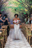 This dress fits like a glove and is stunning. I received so many compliments as the bride. While the dress is perfect and fits standard sizing it has no stretch. Be honest with yourself and wedding diet to get this thing zipped up. I could have dropped a couple of pounds and it would have fit even better but I'm happy with how it looks on me. 

Since it can be tight the bottom skirt portion started to ride up and get stuck as I walked causing me to pull it down. Wear flats to not show feet and to show off as much of the train as possible if you're tall. The boning isn't real so if you have a lot of chest be prepared for the structural integrity to be challenged. I had a couple of marks left on my ribs from how tight it was but it's a small price to pay for looking great. - Taylor T.