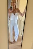 Such a lovely jumpsuit, very glam! It's a great fit with good rubber tack on the chest to keep it in place! Lovely heavy fabric so hangs beautifully. So pleased. - Tiffany S.