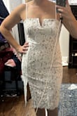 I like the dress, but it didn't have enough of a wow factor for my own wedding. Very flattering. Had I kept it I would have added some lace to the inside of the slit so you would see that instead of the flesh-colored lining. - Sarah D.