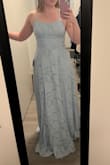 I was worried about the slit being too high, but when the dress just hangs, you can't really tell it's even there. You can choose whether or not to pull it aside, and it looks great both ways. Very comfortable, I wore it to a wedding and danced all night, no problem. Definitely had to get it hemmed after the attached picture because I'm 5'2, and it's a medium, but so worth it. - Amanda L.