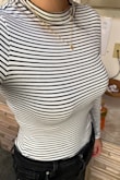Great shirt, fits perfectly. It's tight and well fitted which I love, but there is a smell which I'm hoping will go away after I wash it. I know with some clothing the smell never goes away, and I really hope it isn't the case with this brand. - Kodi K.