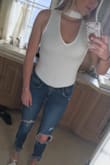 I love this bodysuit so much that when I washed it with my darks (oops) I had to buy it again. It is my favorite article of clothing, fits tight in the good ways and you can wear this with a nude bra! - Kelsey M.