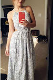 Love this dress so much! The keyhole openings on the side make this maxi dress really different from everything else I've seen. The pattern is beautiful and toned down enough that it will still be trendy a few summer seasons from now. The leg slits on the side will definitely reveal your goodies though if it's windy, I had to get that altered. Other than that, love this dress! Oh, I also didn't have to get it hemmed which was nice since I'm so short, but I can only wear heels with it. If I wear sandals, I sort of trip over the extra two inches of fabric if I'm not holding it up. - Brittany J.