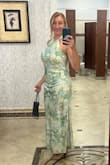 This dress is really beautiful. The material and colors are very nice. The halter neck is pretty. I am three months postpartum so I sized up from my standard small to a medium, and it worked well. I would normally get small, as it seems to fit true to size. Highly recommend. - Laura B.