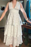 Lovely, lightweight, soft dress. I'm small on top and large on bottom. Because this dress is sleeveless and loose in the hips, the small fits perfectly. This will be my reception dress if I need to change for dancing. It was on sale and I am so pleased with it. - Melissa L.