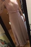 This dress is exactly what I though it would be. I wasn't my choice to get this dress since I'm a bridesmaid. It's a pretty dress. The material is thick and stretchy. But shows everything. Now I need to work out and tone up so I don't look bad in the dress. It fits perfectly. My problem with the dress is that no matter how you put it on and use it I think it just looks meh/blah. I'm not sure why it has amazing reviews honestly. And since the dress shows everything idk how to wear it without my bust showing through and it needs to be appropriate for a wedding. - Jasmine P.