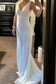 The dress is gorgeous and fits like a glove. It is too long so will need to get it altered there. Otherwise it is beautiful! - Lauren P.