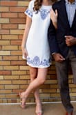 I wore this for my engagement photos. The material is high quality and not see through. However, the length is short. I am 5'4" and I think it hit pretty high above my knees, if you are taller than me you probably wouldn't be able to raise your arms without being exposed. Embroidery detail is beautiful and zipper is high quality. - Hannah J.
