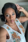 The dress is super cute and fits true to size. I got a XL and could have sized down. The dress still fit and was comfortable. - Aneshia C.