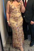 Love this dress for the fit & length, not having to do any tailoring is a win. The outer layer is mesh with the sequins. Unfortunately, I got caught in a screw on the back of a chair and ripped it - so be careful what you rub up against. Dress is super comfortable; my only complaint was the sequins under 1 of my armpits were scratching me badly while the other side thankfully didn't. - Melanie S.