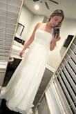 It is a beautiful dress. Way too long for me because I'm 5'3 but I will get it hemmed. I bought it for my courthouse wedding. I also like it better with the straps tied around my neck. - Stephanie M.