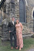 I ordered this dress for a fall wedding with a cocktail attire request. This dress is more beautiful in person than online. The slit is in a great spot for my height but some may think it comes a little too high. The bust clasp was in a tricky spot where it made the dress gape open in two weird spots so I had to have it tacked and the snap that came with the dress removed but I still wouldn't have returned it for this reason. I am so happy with this dress and can't wait to wear it again for a different occasion. - Katie B.