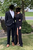 Wore this dress for a gala. Leg slit was pretty high and made me a little uncomfortable at first as a mom of two in my late 30s. I used my purse to cover my leg when I was sitting down. My arms are toned but not what I would consider muscular and the sleeves of the dress were quite tight but the material had some stretch which prevented the dress from being uncomfortable. There is slight boning in the sides of the dress which I appreciated. I got used to the high leg slit as the night went on and ended up feeling beautiful and comfortable in the dress. I appreciated the modest neckline of the dress as well. Overall, I felt the dress was a good quality and trendy yet appropriate and I would recommend it. - Amy B.