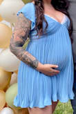 Absolutely loved this dress! I ordered it for my baby shower, and was 34.5 weeks pregnant when I wore it and it was so cute! The slip underneath had enough room for my baby bump and I did end up putting a lace bralette on to hide the girls a bit but I am so excited to wear it again now that baby is here. - Carley B.