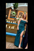 Loved the dress, it didn't slide down a lot. The slit is a little high but overall great - Sam K.