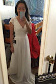 This dress is just as beautiful as the pictures! It's a little bit long in the torso, and will need to be hemmed as well, but I'm 5'2" and a 32B, so I'm not too surprised I'll need it taken up at the shoulders and the hem. Hoping to wear this for a small outdoor elopement! - Katya K.