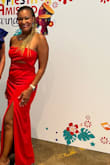 This dress is super fun. I love the pop of red and it's a show stopper. It's a hard dress to find a bra for so I ended up wearing nipple covers and tape to secure the front top.
The back kept sliding down because the band around the top isn't secure enough. Other than that, the fit is great and I love the dress. - Nicole S.