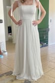 I absolutely love this dress!! It is so heavy it is almost the weight of my actual wedding dress, so I can tell that it's amazing quality. I will have to hem it about 2 inches though because it came really long. Otherwise, it fits perfectly! - Julia M.
