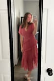 This dress fit perfectly and was the right length for a more casual/rustic wedding. The pink pops, and there is a slit in the right leg to show off some skin. The dress does come a little low in the chest area. Overall, a great dress choice for any occasion! - Maci C.