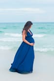 I actually wore this dress for my maternity pictures!  It worked great, although a little snug around my ribs at the time!  I was about 150lbs. and my normal weight is 120lbs. It still fits, although I think I like it better when I wore it for maternity.  ;) - Mary R.