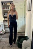 Fits perfectly and true to size! Most XS I've been purchasing on here have been running large. This one fits perfectly. You can't tell by my pic though! It looks like I'm spilling out a little because I took the photo before I was able to zip up the back all the way (I needed some help)! I'm going with another blue velvet dress I ordered here because it matches my bfs tux better. But I'm still keeping this jumpsuit. Too cute to return. I'll find an excuse to wear it somewhere! - Kelsey J.