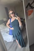 I LOVED this dress. It was so comfy and sexy and beautiful. I think it's ALL THE WORDS. I wore to a wedding and it was great for dancing. The material offers some stretch. It was slightly long on me even with heels so I had the bottom hemmed. The first photo is after alterations and the second was straight out of the shipping bag. I would highly recommend this dress for any dressy occasion. I could have probably done down to a small but didn't want to risk it. I will say because of the layers you're better off not wearing shape wear because it can bunch up a bit. I ended up taking mine off mid-reception. The color is gorgeous as well. I just love it. - Ashley P.