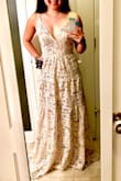 This dress is definitely the most beautiful dress I have ever worn. I will however need to get the straps taken up, wear a plunge bra, and have the bottom hemmed. It fit perfectly around my waist area. It is super long even with 3 inch heels on, but that was to be expected. The inner skirt is form fitting and the outer lining is flowy. - Kristina W.