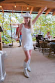 LOVED this little white dress. We were married in Montana and the night before the wedding was western themed. I added a fun white cowboy hat and sparkly boots and received so many compliments. - Erin W.