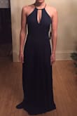 Ordered this as a potential bridesmaid dress, thought it was super cute! It was a nice dark shade of navy. A little long as Lulus dresses normally are. I didn't try it on with shoes, but it probably would have required at least 4 inches of heel. The style was very flattering, love the design of the top in front and back. I tried it on with a stick on bra that clasps in the front, and the clasp was barely visible. It could easily be hidden by pinning somehow. Unfortunately, the front was too revealing for what the bride is looking for, so it was a return. Would love to get one in the future just to wear as a guest to a wedding! It looks deceivingly like it might be revealing, but it's actually covers in the front pretty well. - Heidi P.