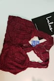The large was too large around for my 34D breasts. I am waiting for the medium that I have returned it for. I love the color and the shape of the back. - Lily G.