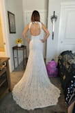 This dress fit so beautifully and is made so well! You wouldn't believe the dress was the price it is. I have a small waist and a bit thicker hips and the small fit like a glove. It does not have any stretch to it, so if you have bigger hips, size up. The back is the highlight of this dress! The only thing I would change is the beige lining. It sort of flops out in the front and really should have been sewn onto the lace so it doesn't stick out. I am having that fixed, but other than that, the dress is stunning. I definitely recommend it! More pictures will follow after our wedding if I am able! - Tiffany H.