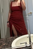 Dress is lightweight, material is good quality, and the fit is flattering. I was under the impression the dress was rust orange, but when it arrived it was more of a rust red/brick color. I liked the slit on the dress because it was visible, even when not posing, and was a good amount of revealing imo. Although I was considering pinning it bc if you're not careful it could open pretty far. The neckline ended up looking very square on me. The one thing I didn't like was the fit on the chest; the straps were pretty long so the fabric over the chest sat a little too low and was saggy bc it wasn't pulled tight, so it made me look a little boxy, as opposed to curvy. Definitely needs a hem even in heels at my height. Overall tho, if you like the picture and the style, it is a great dress and I would recommend buying it! - Madison D.