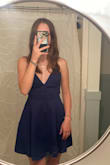 I really really like this dress. It fits very nicely and looks great on me. I really like how there's a slip underneath so I don't have to worry about like leaning forward and being afraid of it riding up. I love the open back too. People have said the straps fit weird but I think it's just fine I mean it's odd at first but it doesn't bother me really. I got navy and it's just as pictured. I was afraid that it would be too loose around the chest area but it wasn't. I'm kind of proportioned so I'm in between sizes, but I would pick what waist size you are since that's the most fitted part. I got size small. I have really long legs and was scared it would be too short but it was just at mid-thigh for me which was great. I would say you should steam or iron it before you wear it out but that's just because of shipping stuff which is no big deal. You should definitely get this dress. Shipping is fast and easy and didn't take very long either. They also have a good refund and return policy if you don't like it. - Violet W.
