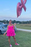 This dress caught my eye the first time I saw it! I was looking for a short dress that wasn't too revealing or too tight. I love the tutu material! You can also adjust the straps. It's incredibly comfortable too and not too short! I wore this for a breast cancer survivors photo shoot. Paired it with pink converse sneakers. - HOLLY S.
