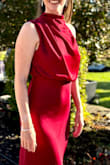 I was a little iffy about the asymmetrical look, but my fashion conscious teenage son assured me it added to the stunning look. I loved the loose top and fitted waist, giving the illusion of a tiny waist. The dress flowed beautifully and was perfect for dancing in. - Amy T.