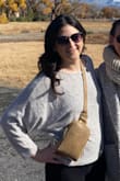 This is a cute top for every day but also nice to wear to work. I wear a nude bra underneath because the knit is almost a bit see-through. The fabric is flowy and not scratchy. - Christina S.