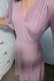 It's a dress you can easily wrap around your body, making it incredibly adjustable and flowy. I like to fly in blind, so it's lovely they have a feature to help with that. I ended up buying a small and I love it! It flatters my shape while keeping me classy!! - Thea W.