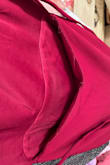 I tried on this dress right when it came and LOVED it, but when I washed it (hand wash delicate cycle), and laid it flat to dry, I saw that several areas had threads coming out and the fabric layers pulling apart from each other. This is very disappointing for a brand new dress!!! - Jennifer F.